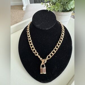 Worthington gold chain link necklace with leather lock